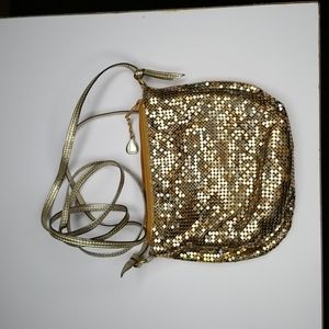 Gold mesh evening purse with long cross body gold strap.